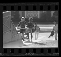 Four school children walking home in Inglewood, Calif., 1967