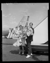 Singer Pat Boone with wife Shirley and their four children after disembarking plane in Los Angeles, Calif., 1959