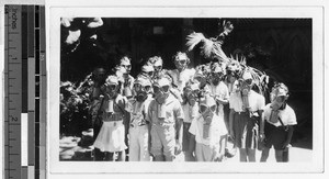 St. Augustine kindergarteners wearing gas masks, Waikiki, Honolulu, Hawaii, ca. 1942