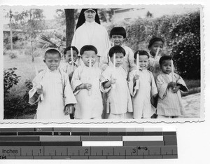 Sr. M. Colombiere with class of orphans at Luoding, China, 1936