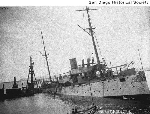 The USS Bennington partially submerged in San Diego Harbor after the ship's boiler exploded