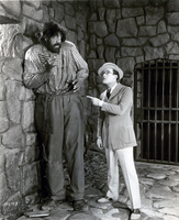Scolding the giant in "Why Worry" - 1923 - (with Johan Aasen), Llloyd walks into the middle of the Latin - American revolution, HL - 13