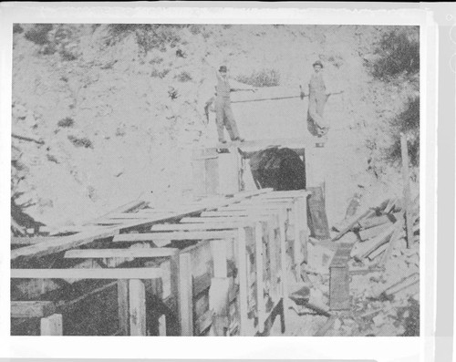 Two members of the construction crew standing on the tunnel by the flume of Santa Ana River #1 Hydro Plant