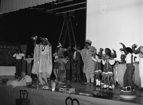 Participants of the 5th Annual African Festival dancing together on stage, Los Angeles, 1984