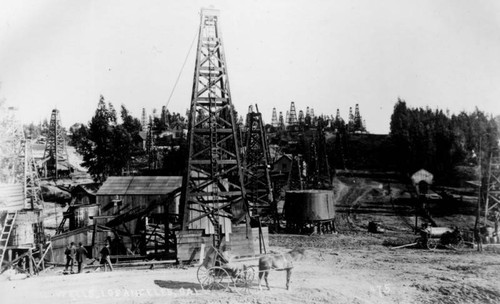 Horse drawn carriage on an oil field