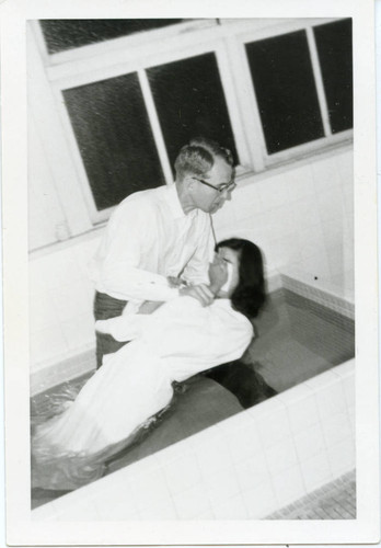 Terry Giboney baptizing a girl