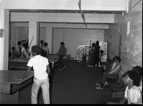 Challengers Boys and Girls Club recreation room in use, Los Angeles, 1983