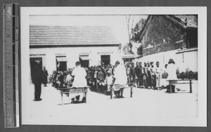 Checking on pediatric health, Jinan, Shandong, China, ca.1940