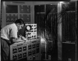 Electrician testing circuits and wiring for a Westinghouse Network Calculator