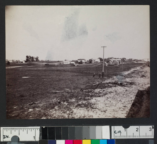 View of a town, possibly along a railroad line