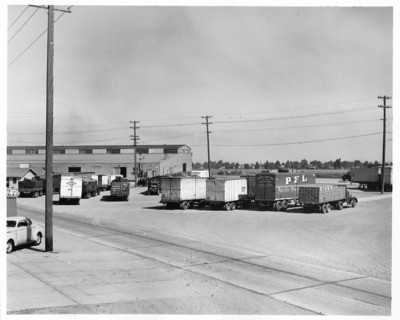 Stockton - Wharves: Pacific Freight Lines trucks and other vehicles are parked at Public Wharf No.3