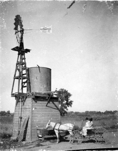 Windmill and Tank on County Road, Tulare County, Calif., ca 1900