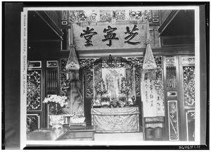 Interior view of a Chinese store, showing small altar in background, Chinatown