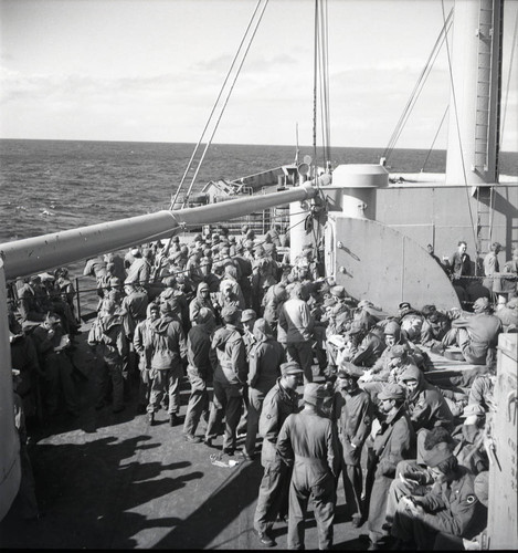Soldiers crammed on the bow of the USS Meigs