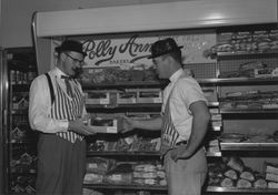 Two grocers in front of the Polly Ann Bakery display, Petaluma, California, about 1965