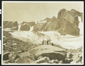 Three mountaineers near Palisade Cirque in the Sierra Nevada mountains, near Mount Sill
