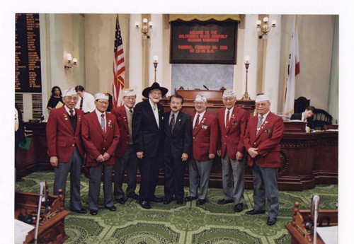 George Nakano, Ralph C. Dills, and others in assembly chamber