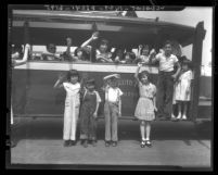 Chinese American children waving from a car at picnic sponsored by Chinese Ladies' Union Missionary Society, Calif., 1936