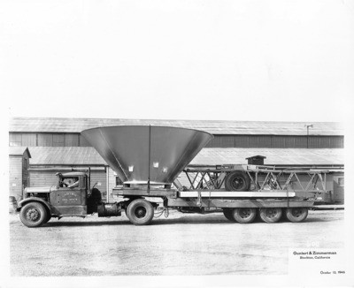 Construction Equipment - Stockton: Truck from Claude C. Wood - General Contractor, Lodi, CA- carrying pieces of construction equipment and machinery, Guntert and Zimmerman Construction Co., 533 S. Aurora St