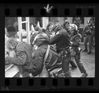 Police arresting students during Chicago Seven protest march in Westwood, Calif., 1970