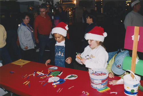 Tree-lighting ceremony with children coloring ornaments, Orange, California, 2000
