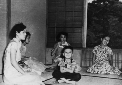 Japanese American boy with friends in Japan