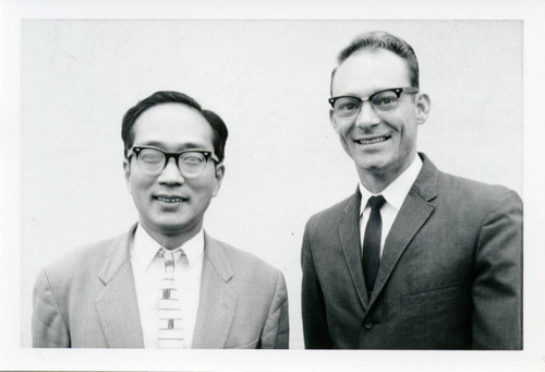 Charles Melton and unidentified man