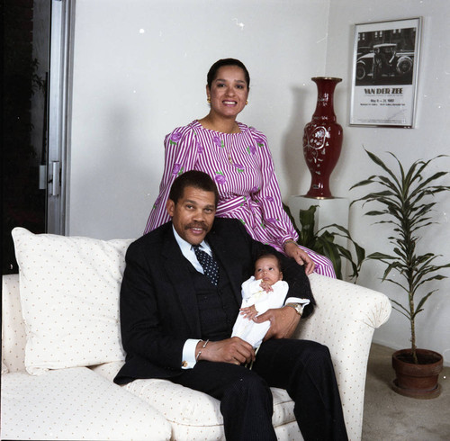 David S. Cunningham, Jr. posing with Sylvia Cunningham and their infant daughter Amber, Los Angeles, 1984