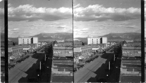 From corner of 3rd and Main Street in Grand Junction, Colo., looking up Main Street; in horizon is Grand Mesa Mt