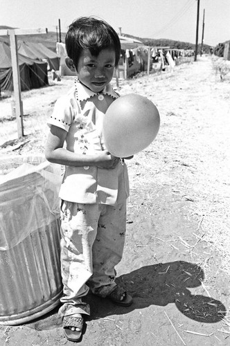 Child holding balloon