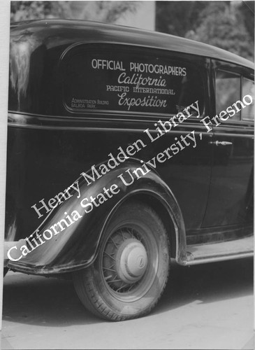 1935 Chevrolet Master DeLuxe, sign on window reads "Official Photographers, California Pacific International Exposition"