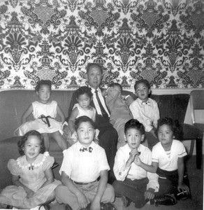 Kyung Hak Yoon and his eight grandchildren