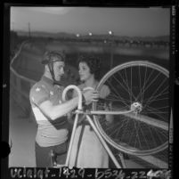 Cyclist Mike Hiltner talking with his wife Neide during training for 1964 Olympics in Santa Monica, Calif