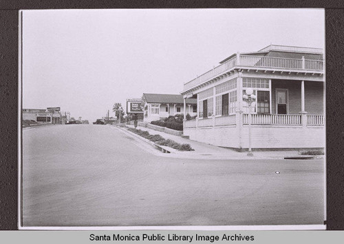 Veranda Apartments, 1557 Second Street (corner of Second Street and Colorado Avenue) with Prince Albert billboard and Spafford's Garage looking north on Second Street, Santa Monica, Calif