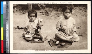 Two girls eating, Puducherry, India, ca.1920-1940