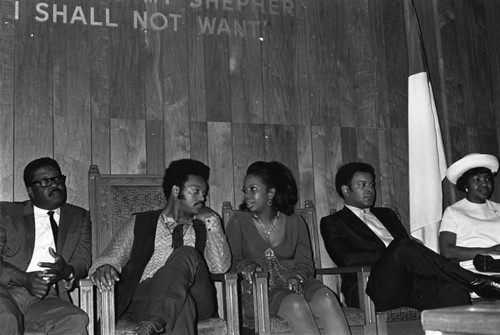 Gladys Knight and Jesse Jackson sitting together in conversation at Victory Baptist Church, Los Angeles, 1970