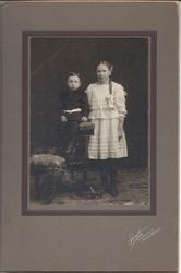Clifford Sharp, age 3 1/2 and Gertie Sharp, age 10 in a studio portrait