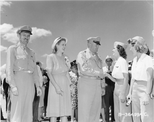 Jacqueline cochran maj. gen. gerald c. brant congratulates wasp edna pedlar after winning her wings. from left to right major robert e. urban jacqueline cochran general brant wasps edna pedlar and kitty leaming. avenger field sweetwater texas august 7 19