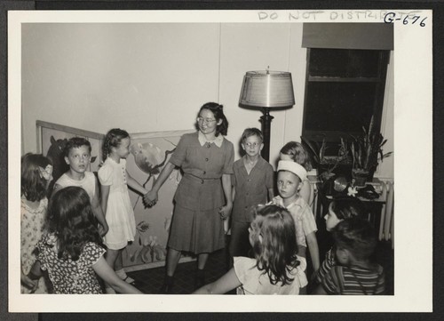 Games with Chico Sakaguchi, a staff member of the Hope Day Nursery, are eagerly awaited by the children. Chico, who relocated from Manzanar in April, 1944, is a skilled social worker, and the children and their parents deeply appreciate her excellent work. Philadelphia, Pennsylvania