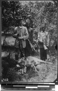 Brother Neumann and shot lion, Unyamwezi, Tanzania