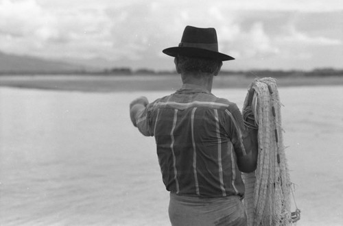 Fisherman and his net, La Chamba, Colombia, 1975