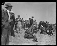 Large crowd gathers on Venice Beach during a search for the missing Aimee Semple McPherson, Los Angeles, 1926