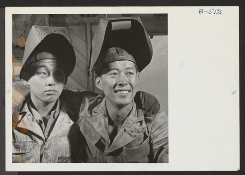 Welders in the machine shop at this War Relocation Authority Center. They are left to right: Shig Yamaguchi, evacuee from