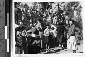 Maryknoll Sister with a group of school children, Kaying, China, ca.1920-1940