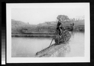 Regulating water between rice fields, Sichuan, China, ca.1900-1920