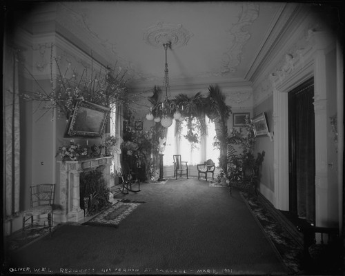 Parlor decorated for anniversary, William Letts Oliver house, 101 Vernon Street, Oakland. [negative]