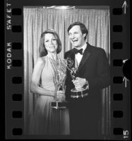 Mary Tyler Moore and Alan Alda holding their Emmy Awards, Calif., 1974