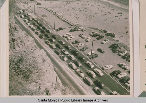View of a solid three lane lineup of cars eastbound on Pacific Coast Highway from the Palisades bluffs, May 30, 1951
