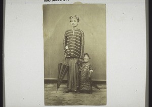 A Siamese man with a child