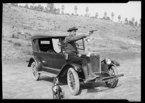 Close up of officer in Chevrolet at police range, Southern California, 1925; Chevrolet police car, Southern California, 1925